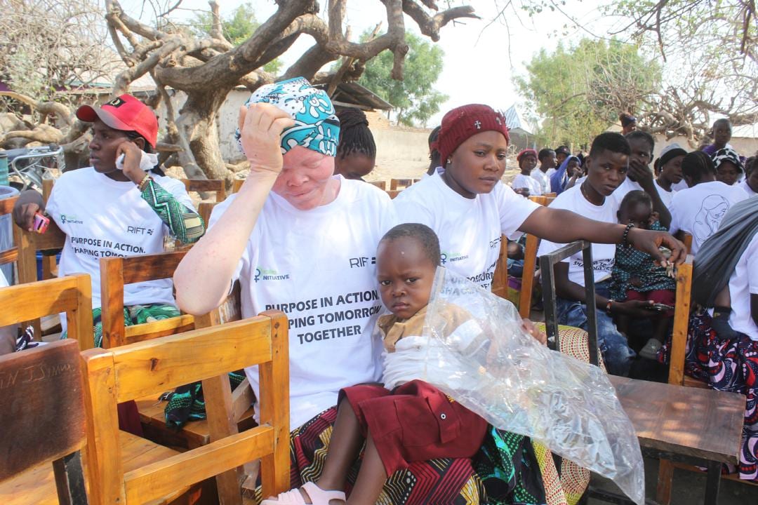 Teen mothers holding their children at the Ivuna Centre launch